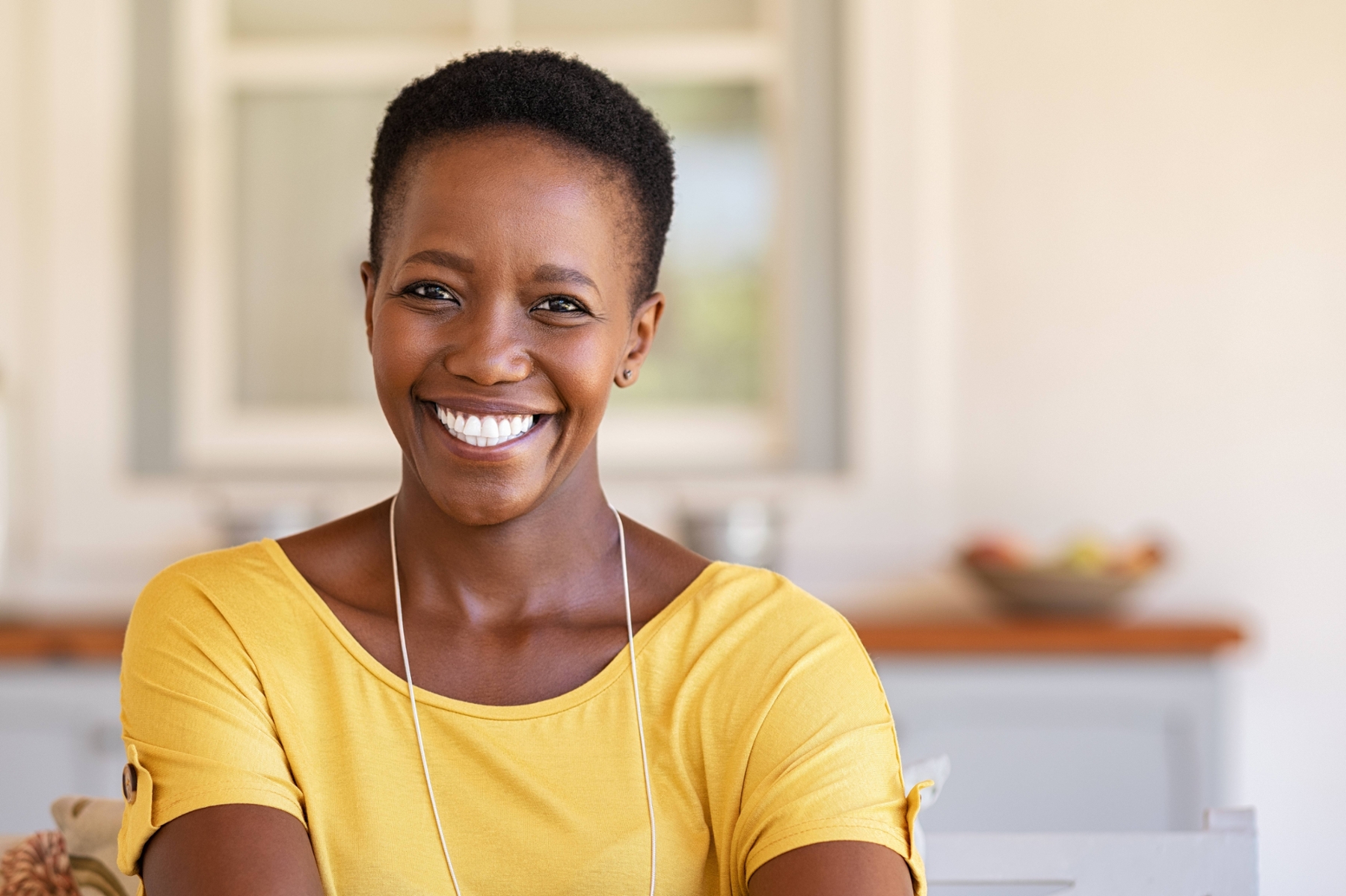 Smiling patient enjoying a healthy, confident smile after dental crown and bridge treatment in Louisville, KY