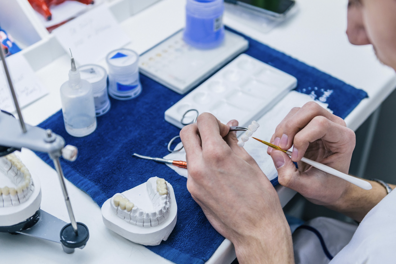 Dentist reviewing denture and partial denture options with a patient in Louisville, KY