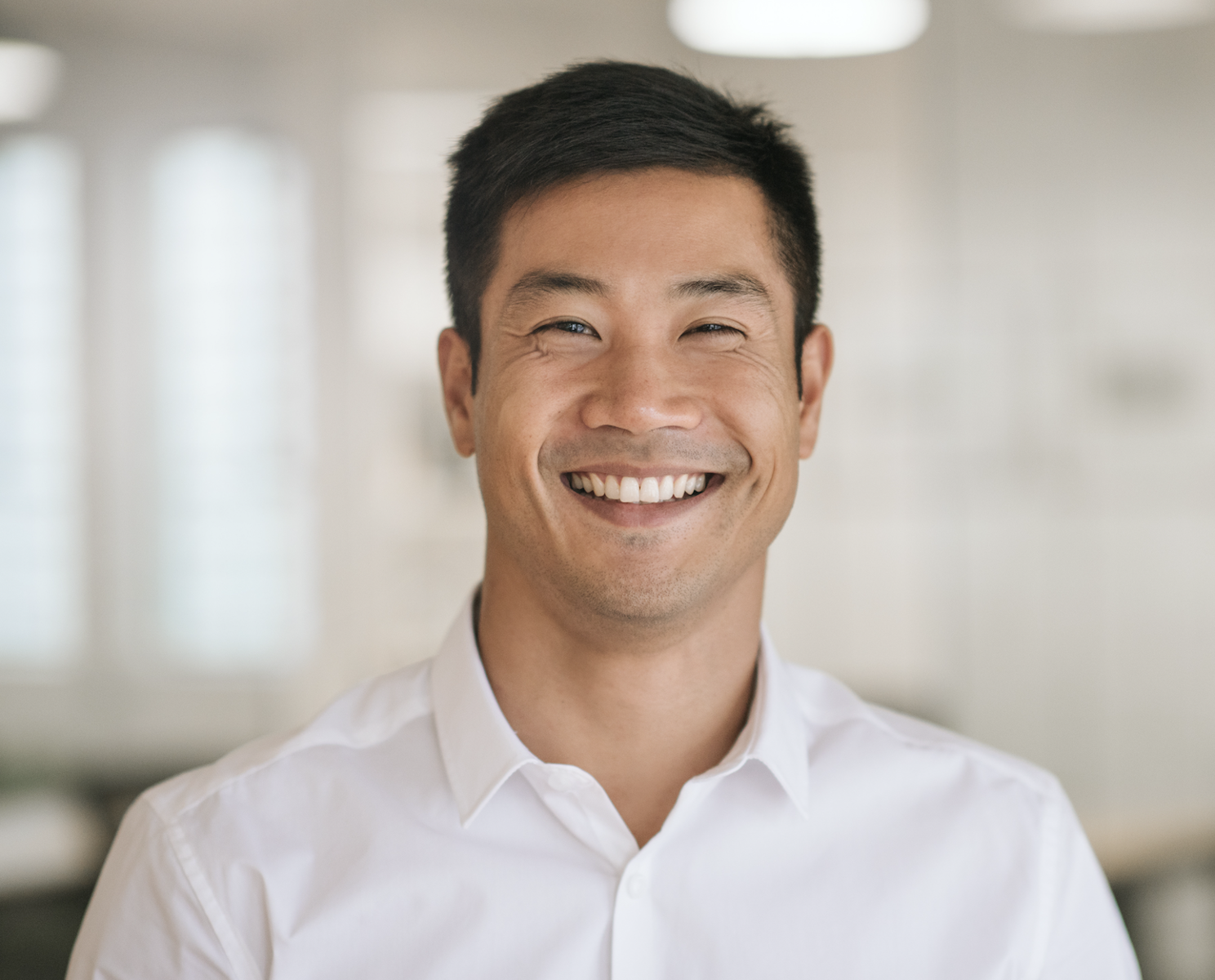 Dentist smiling after discussing a personalized treatment plan with a patient in Louisville, KY