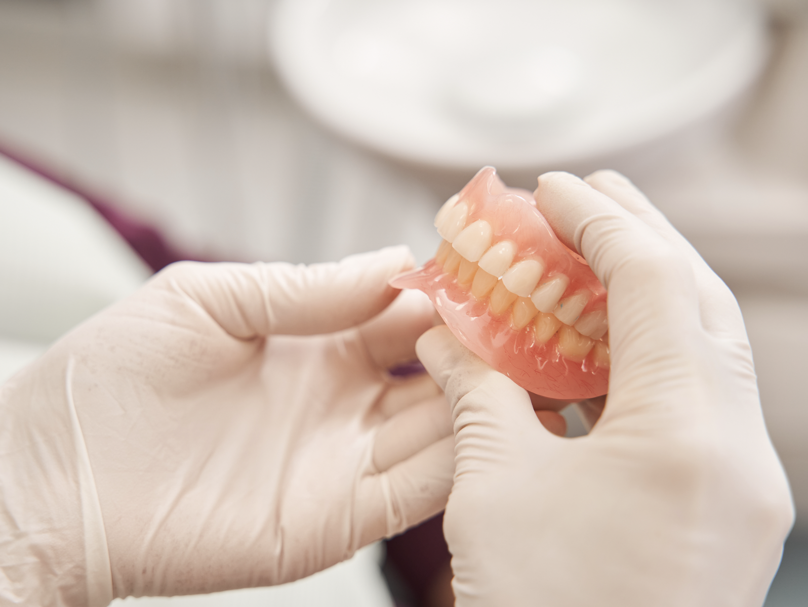 Custom dentures being crafted in a dental lab for a patient in Louisville, KY