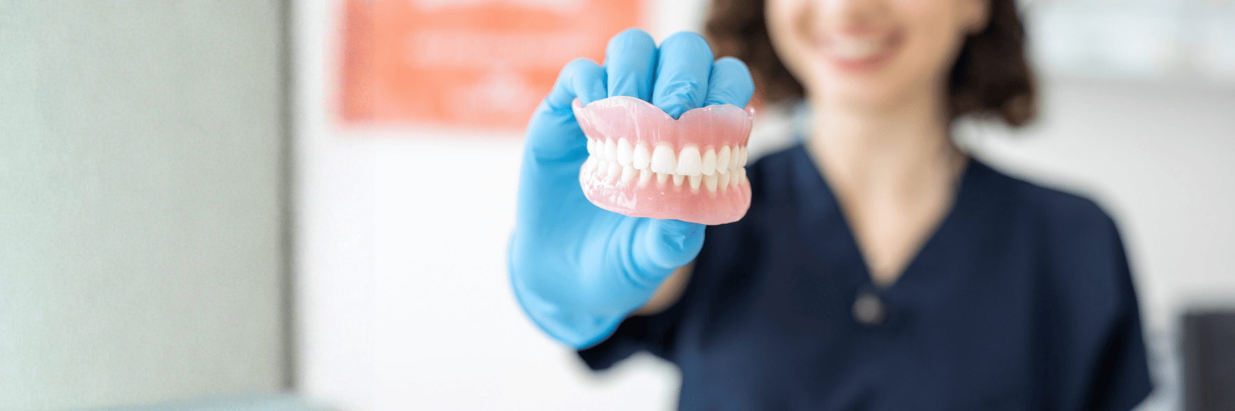 Dental model illustrating denture and partials for patients in Louisville, KY