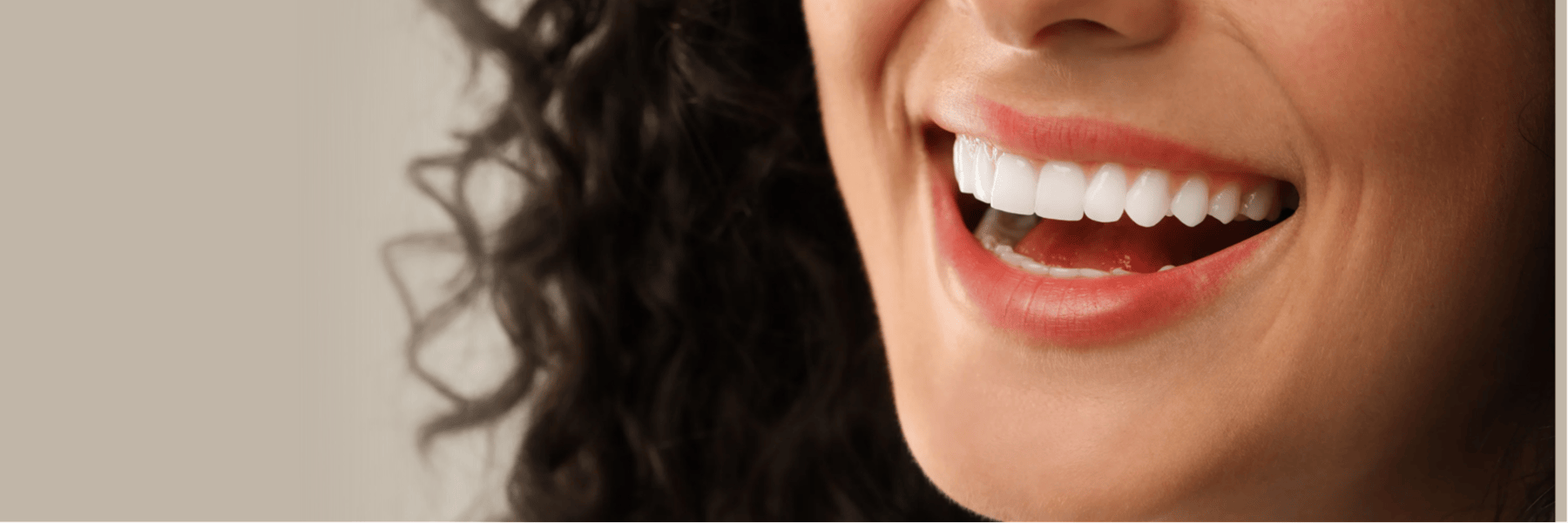 A woman smiling after a full smile makeover in Louisville, KY
